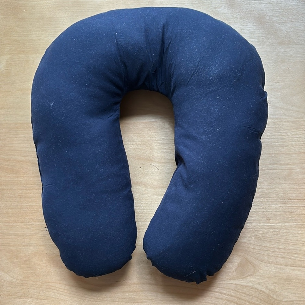 Generic blue foam-filled neck pillow for air travel